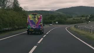 rear of colourful convoy van on motorway