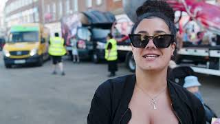 woman wearing sunglasses stood on high street