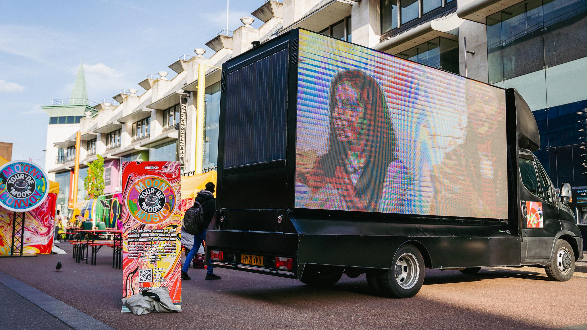 van with large LED screen in town centre
