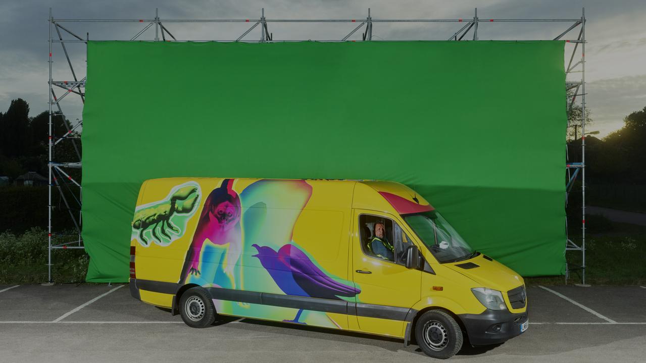 yellow van with images of animals on it